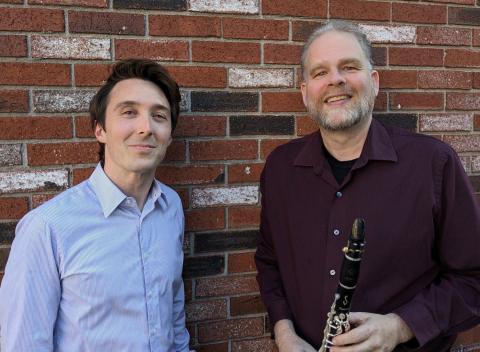 Photograph of the performers, Solon Gordon and Jonathan Russell, standing in front of a brick wall. Photograph of the performers, Solon Gordon and Jonathan Russell, standing in front of a brick wall.
